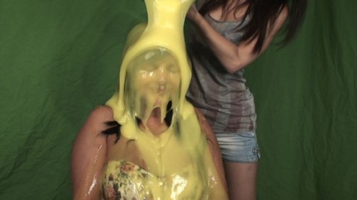 Kiera being slimed with yellow slime.